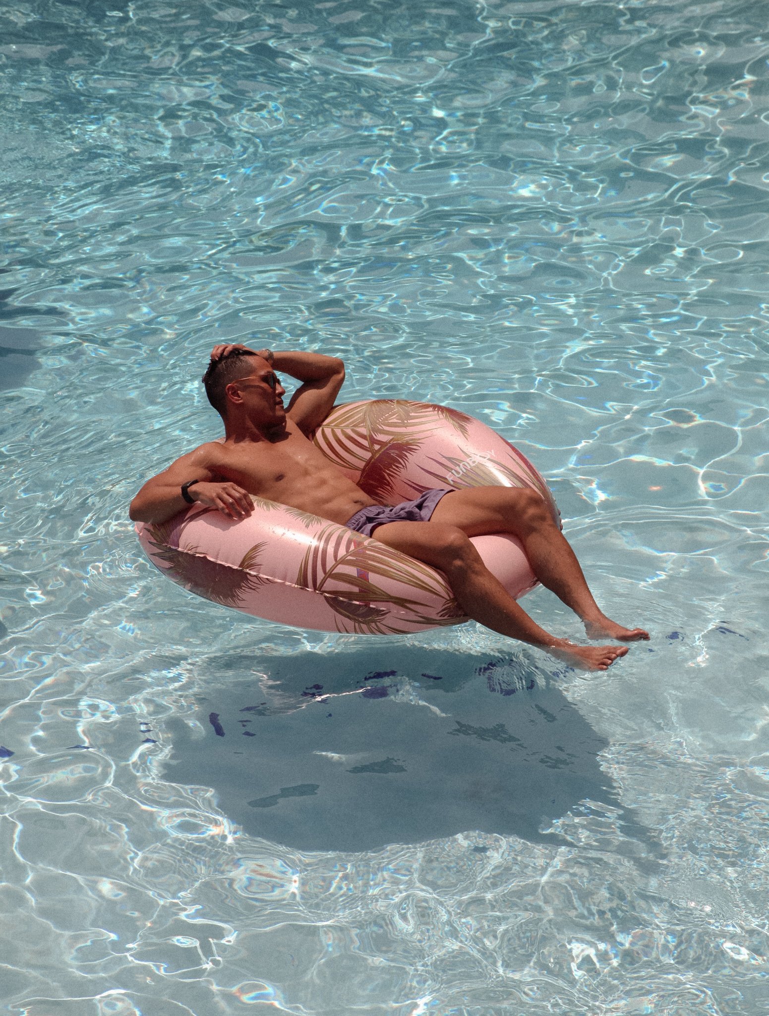 Guest relaxing in pool float at The Shore House
